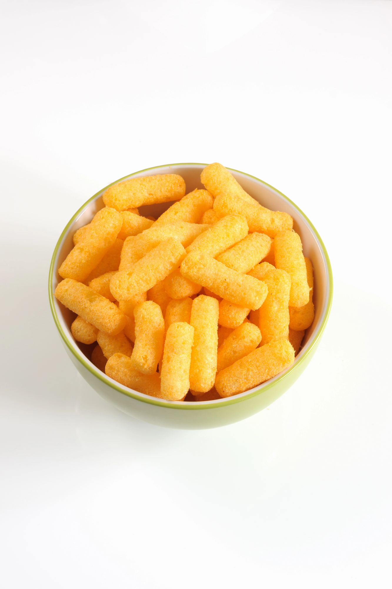 Cheese puffs in a green and white bowl