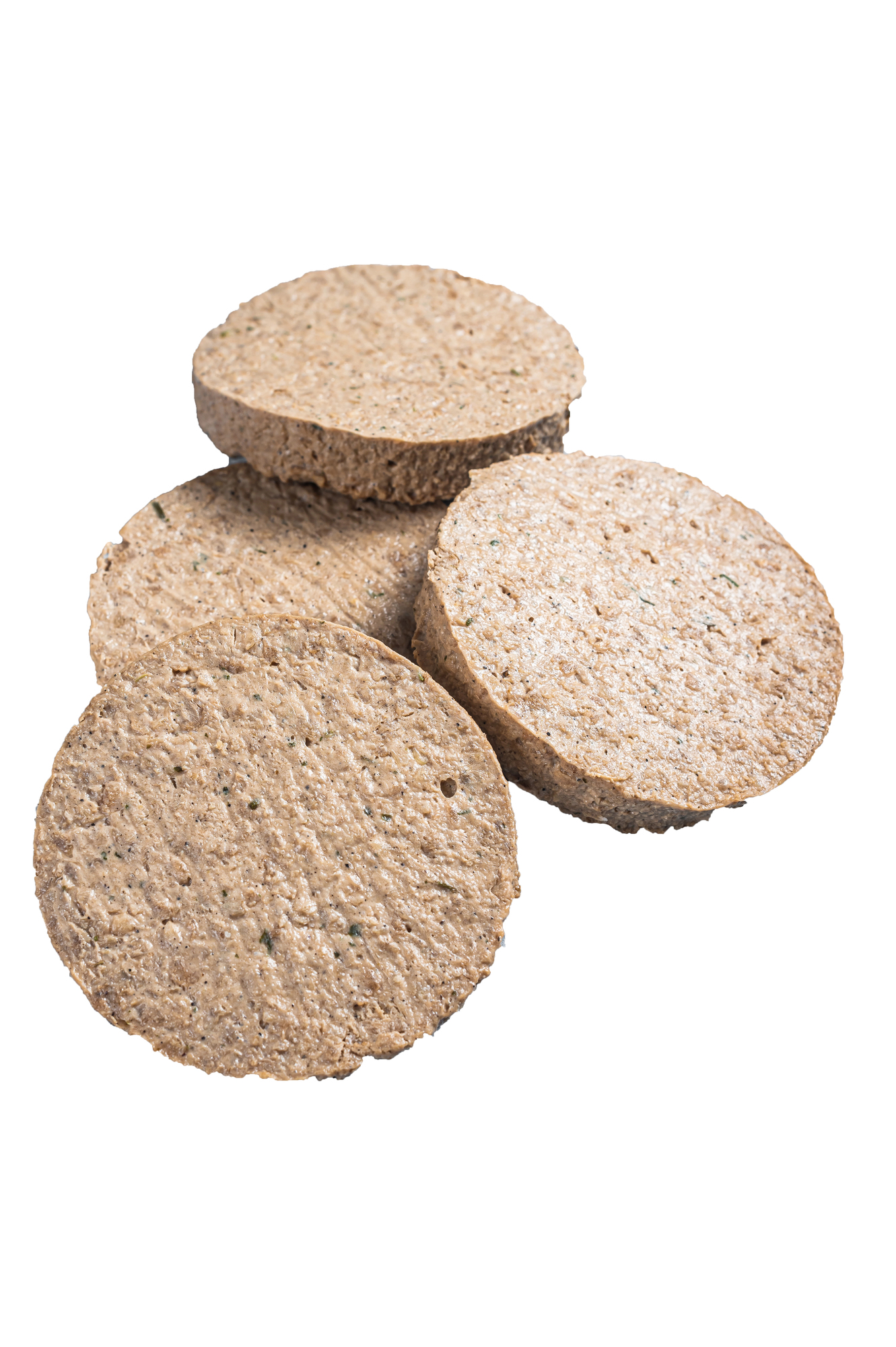 Four raw plant based burger patties stacked
