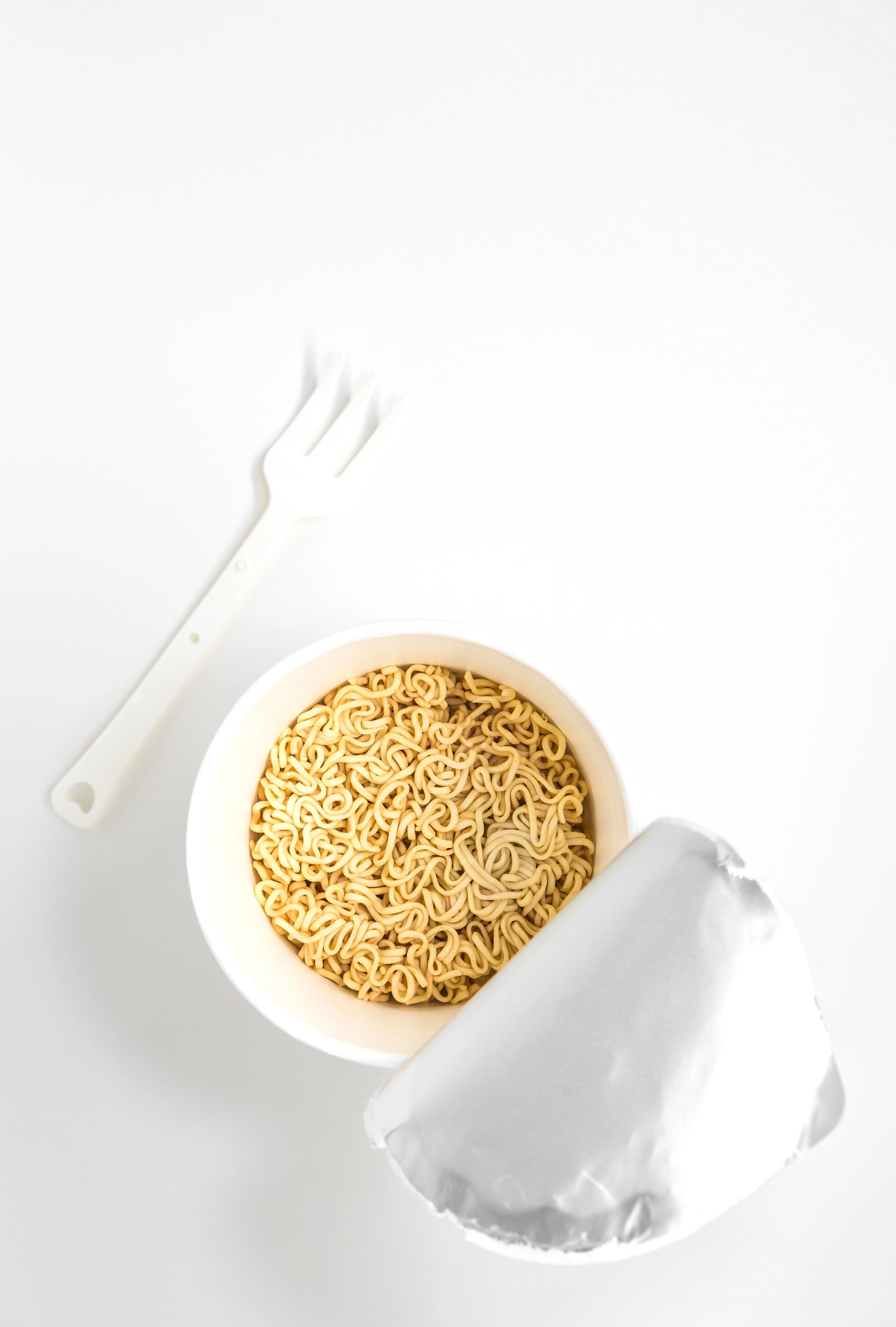 Cooked instant noodles in white paper cup