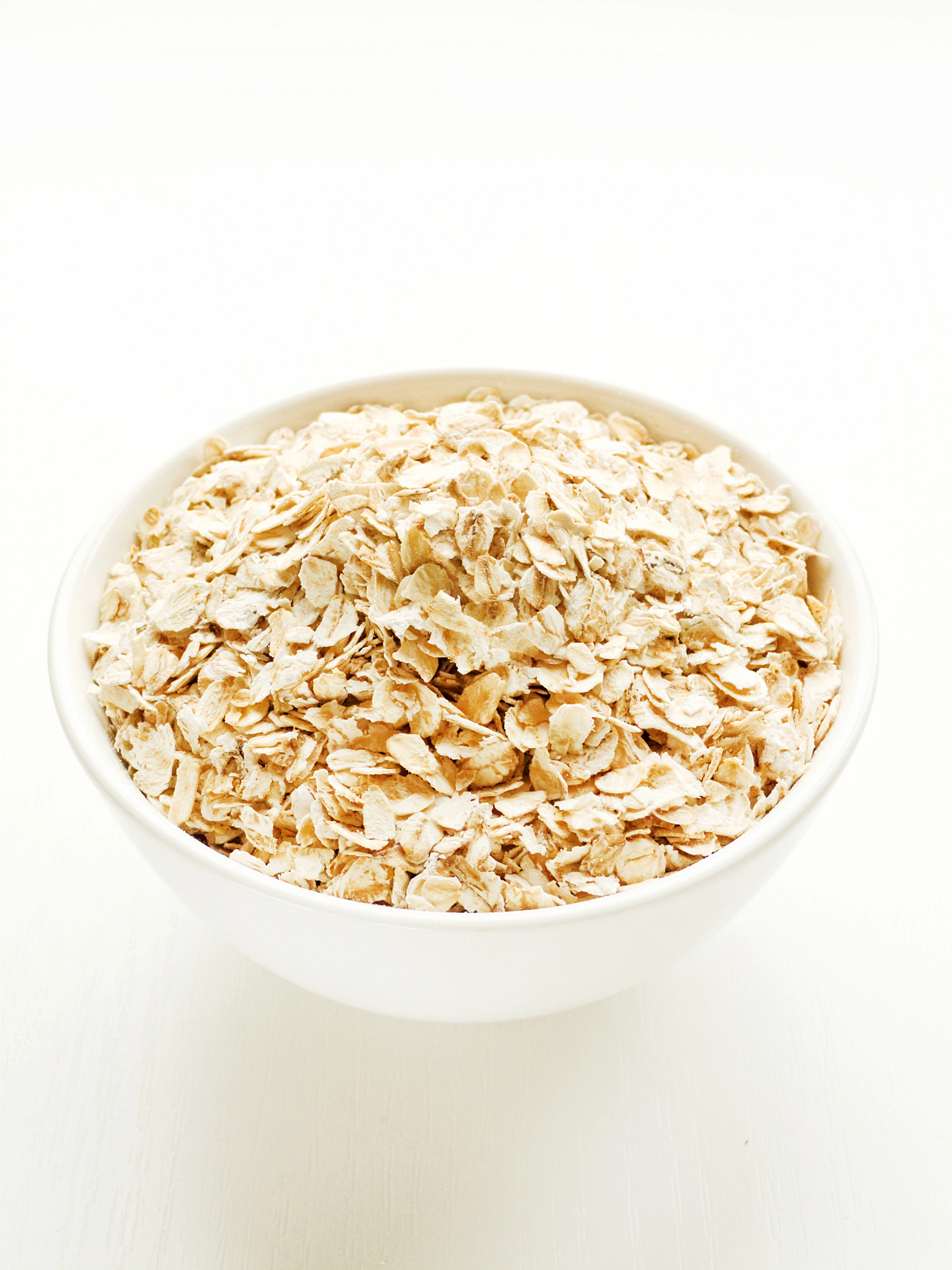 White bowl filled with rolled oats