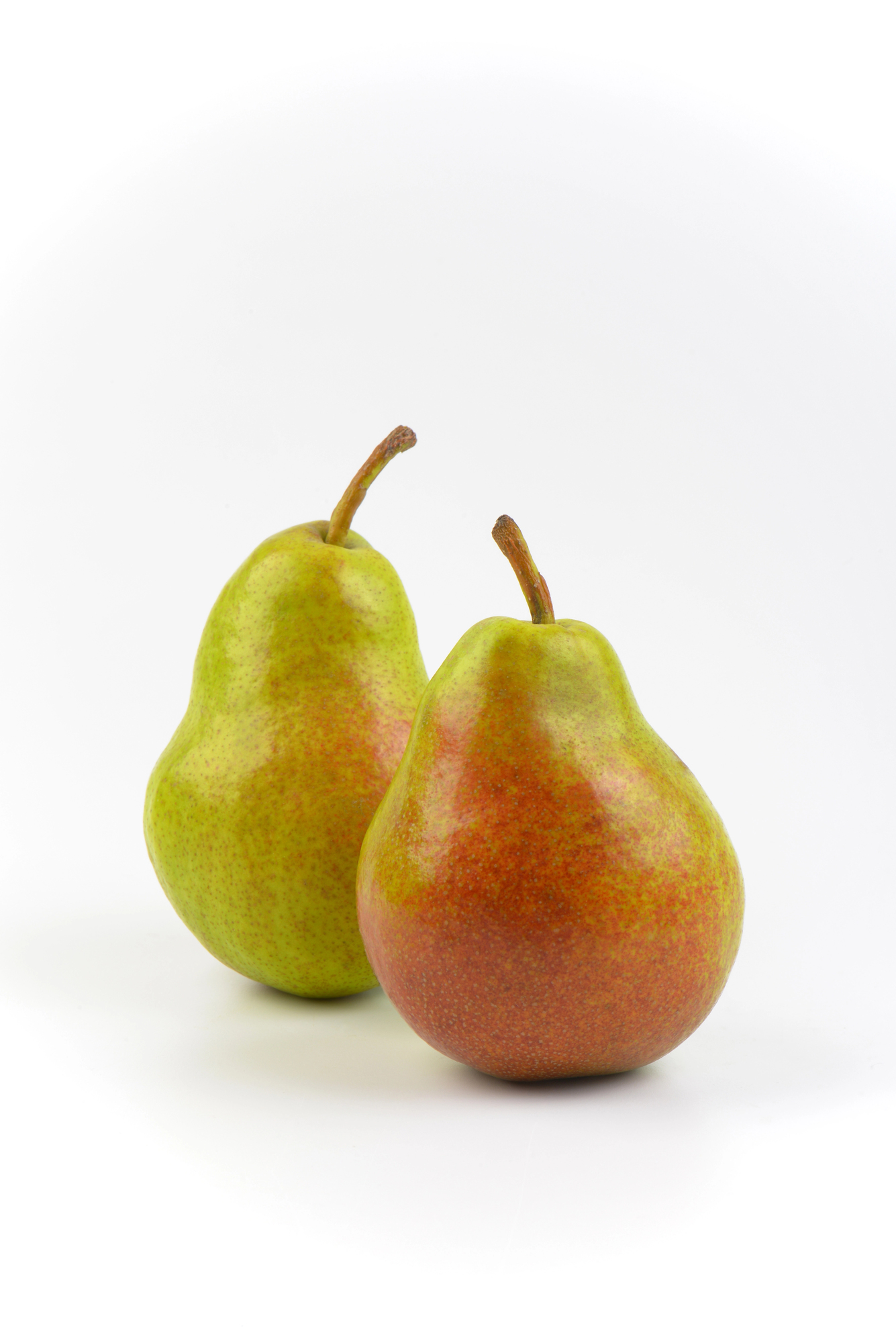 Two ripe pears with stems