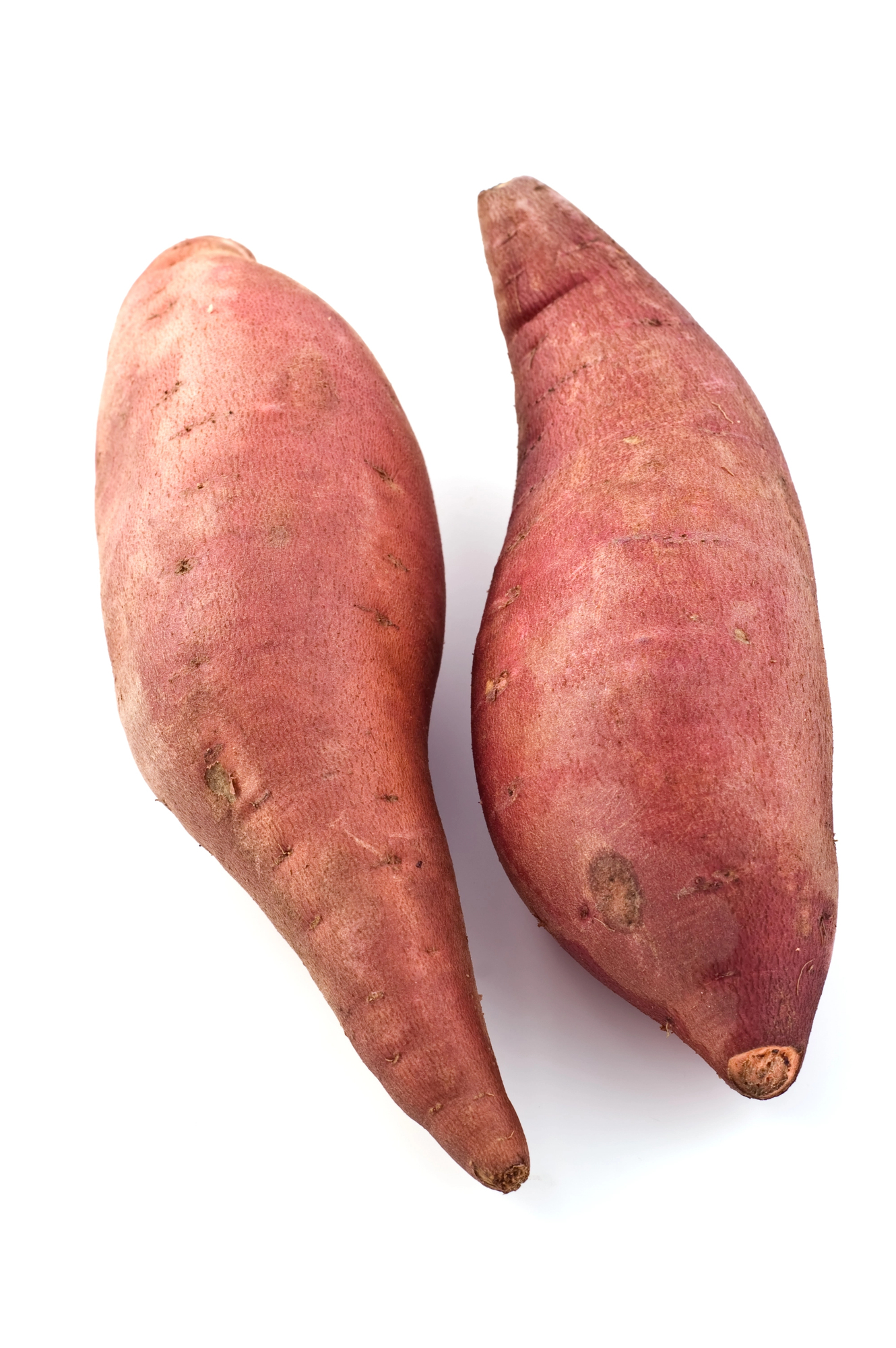Two whole red sweet potatoes