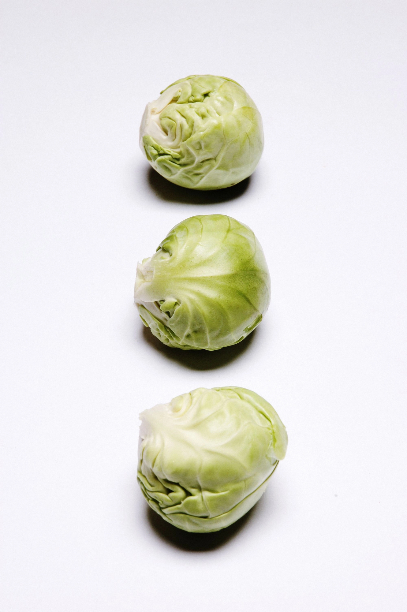 Three brussels sprouts whole and halved