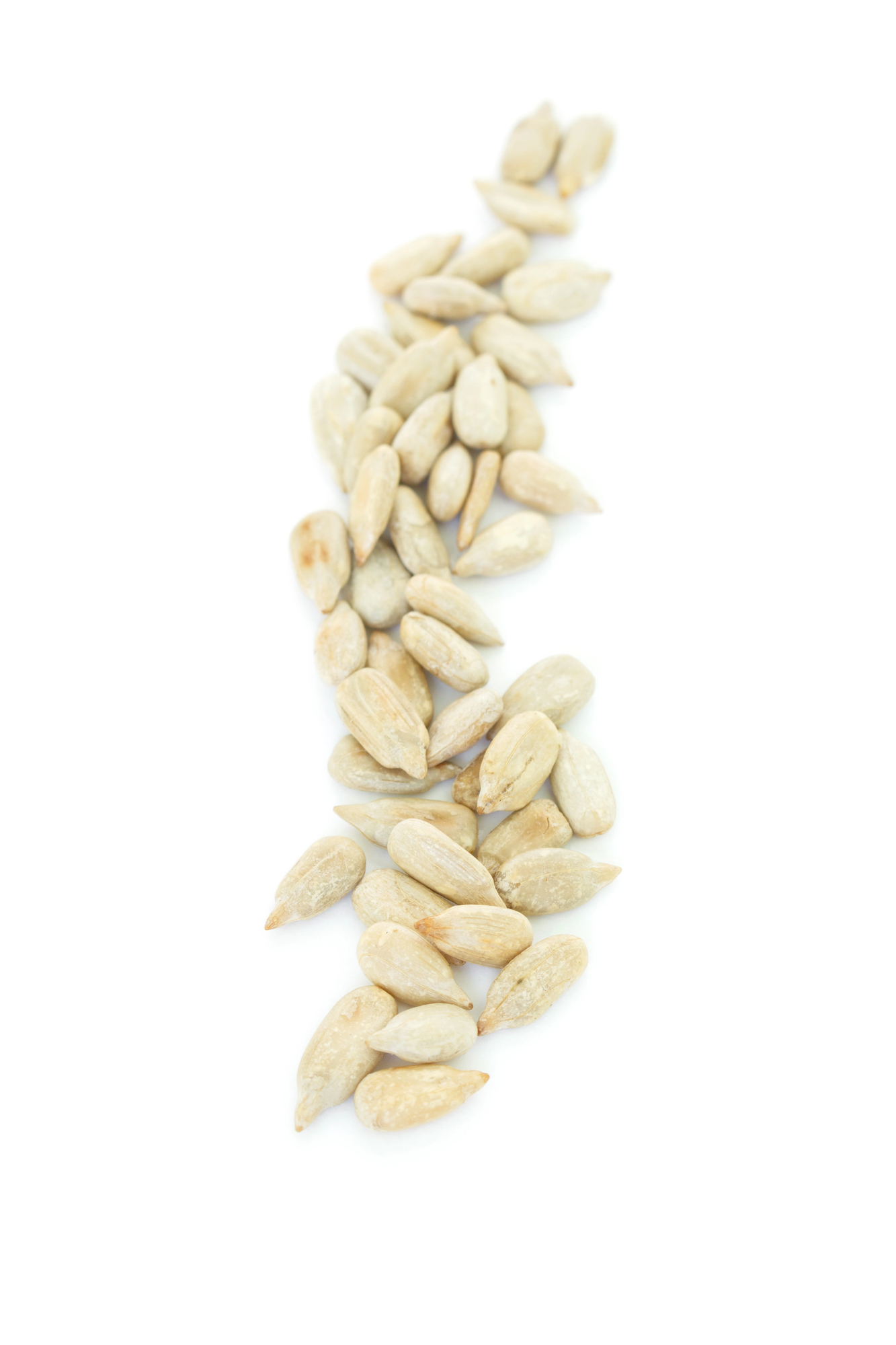 Shelled sunflower seeds scattered diagonally