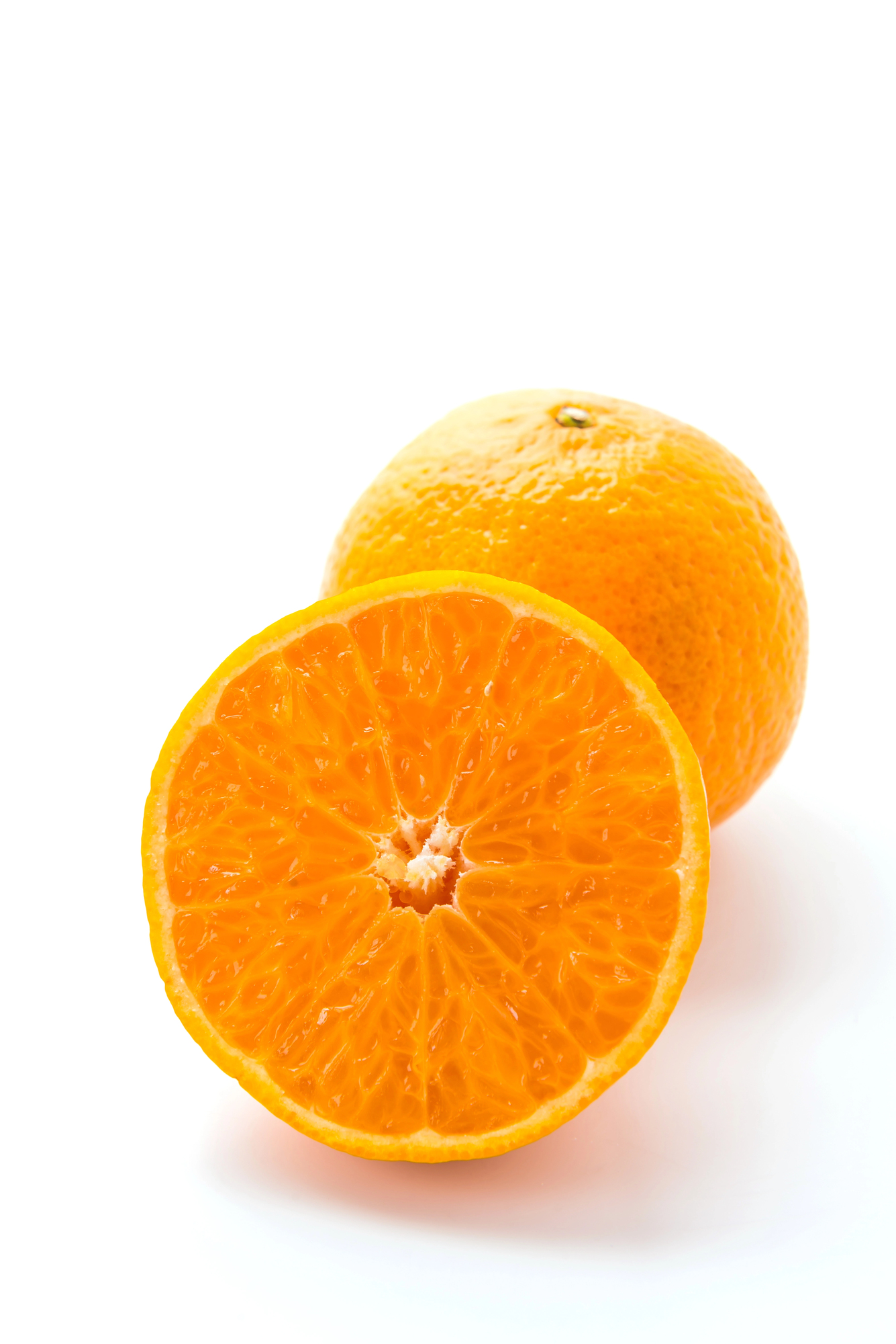 Whole orange and halved orange showing flesh