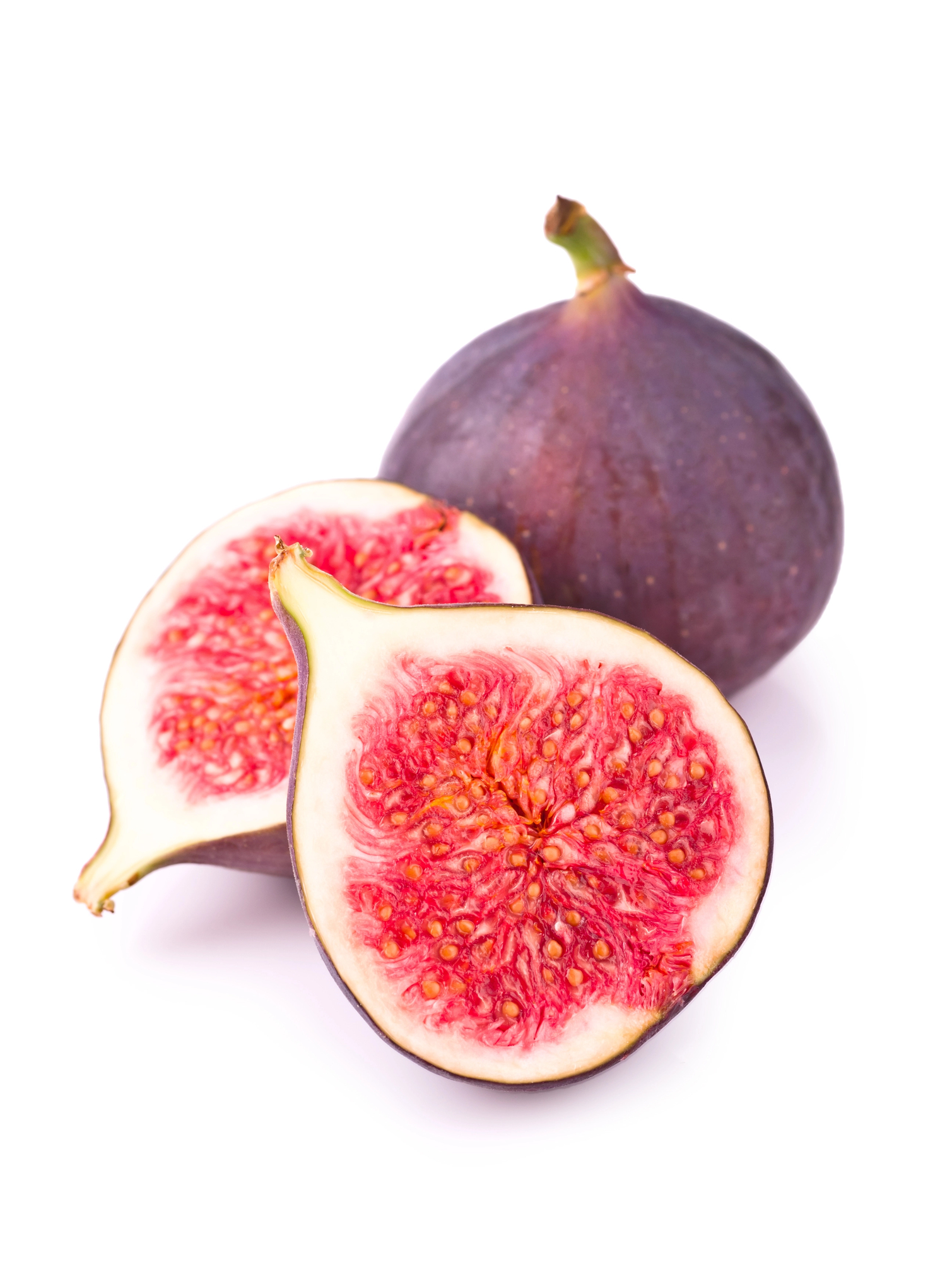 Whole fig and two halves showing pink flesh