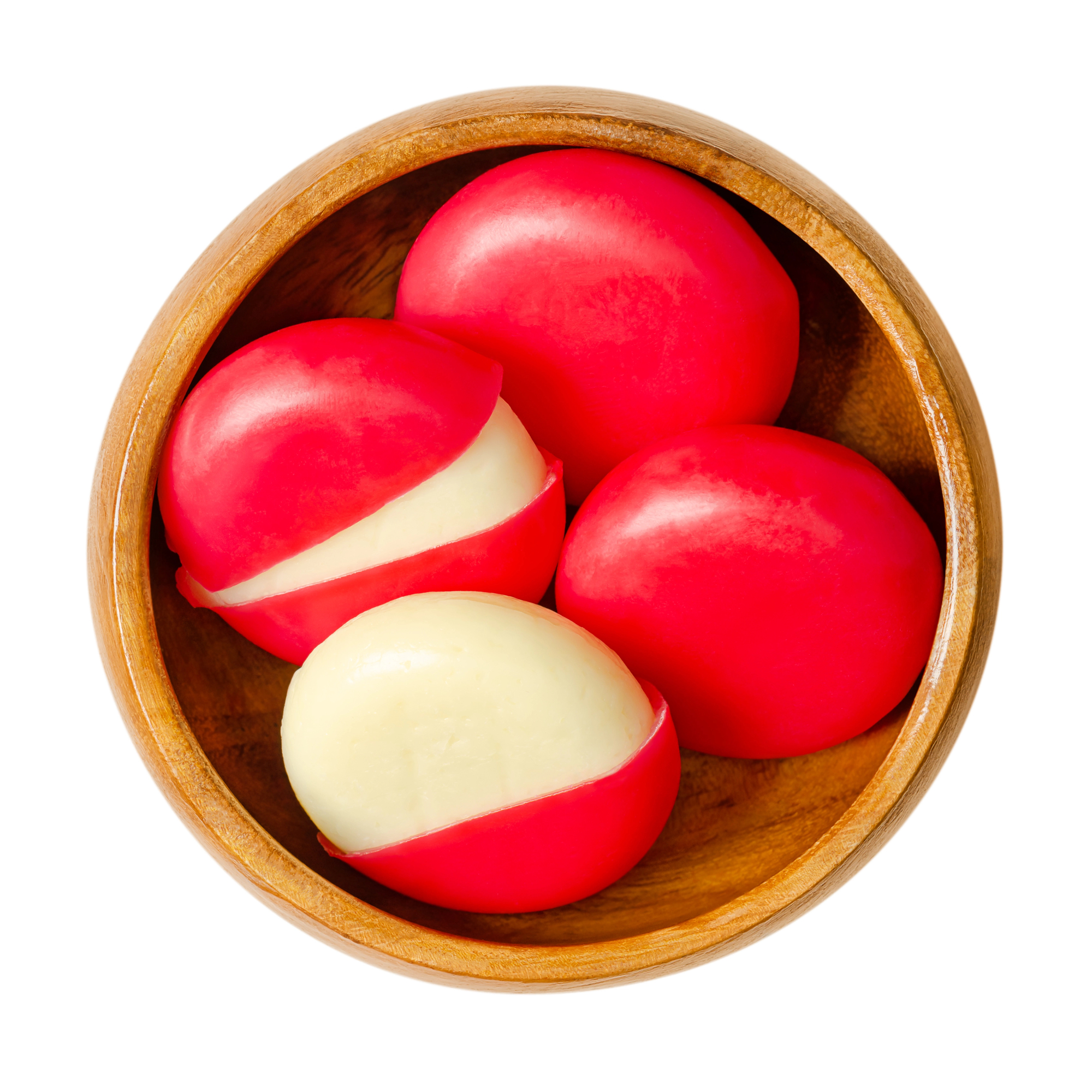 Red wax coated cheese disks in wooden bowl