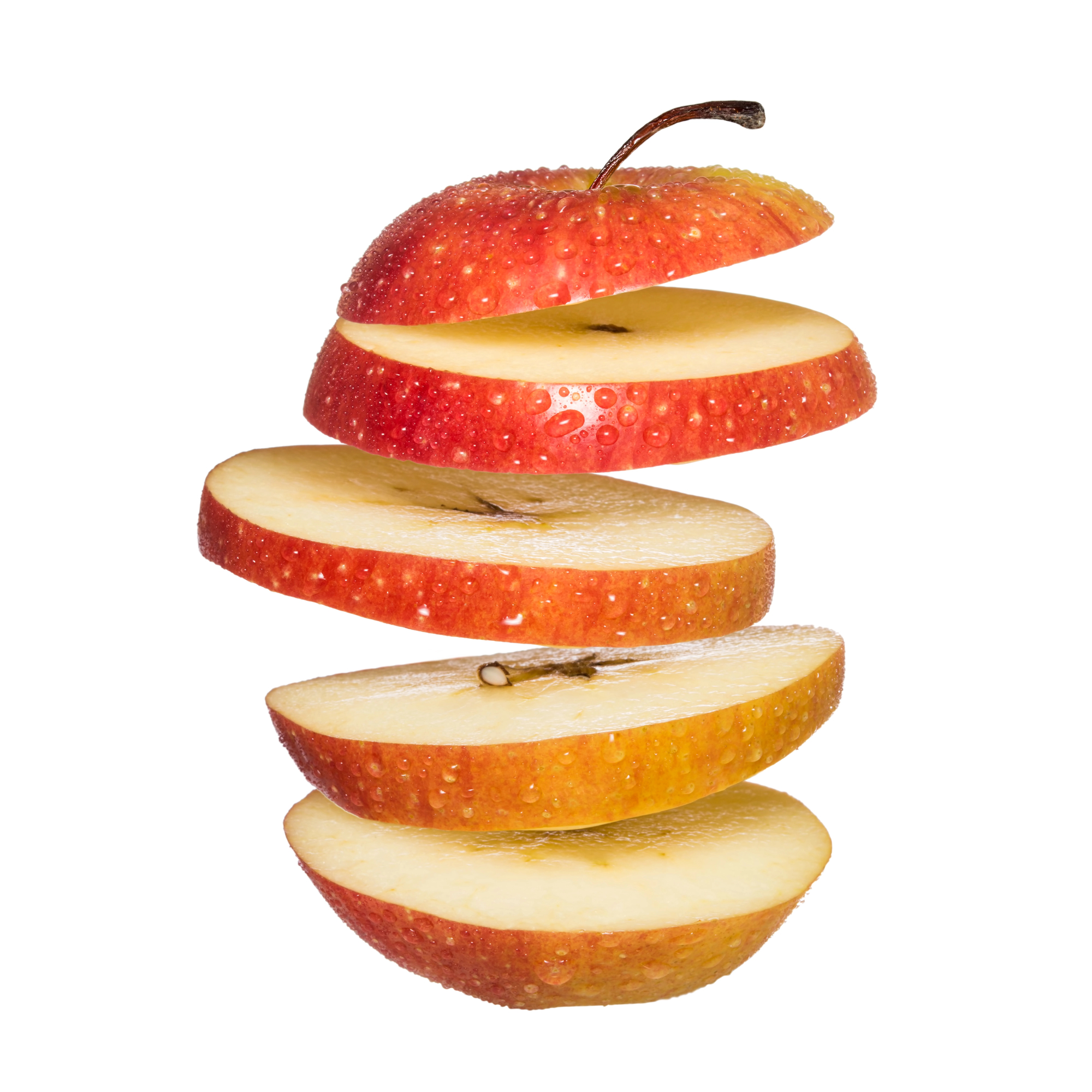 Red apple sliced and stacked with stem
