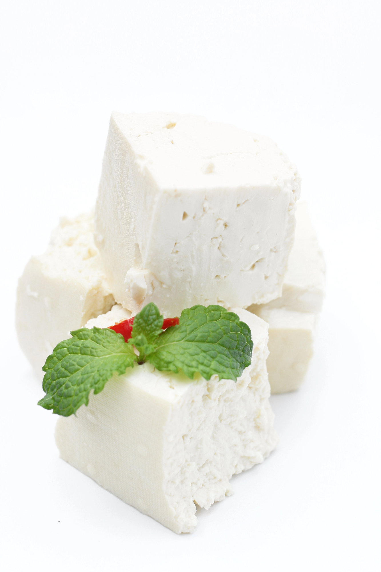 Blocks of fresh tofu with mint and berries