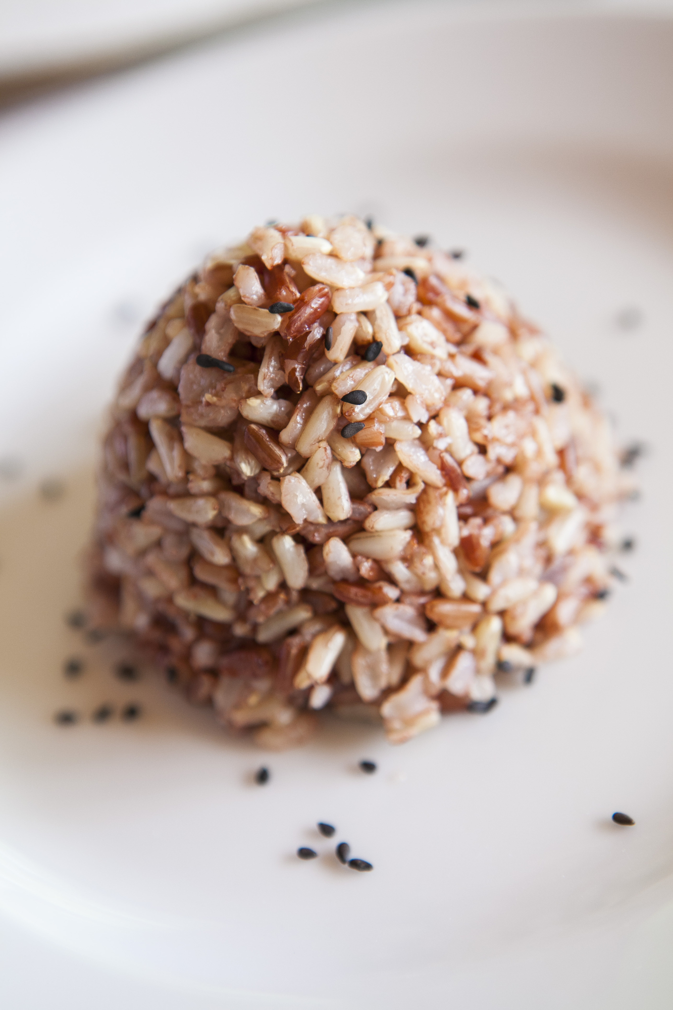 Brown rice ball coated with black sesame seeds