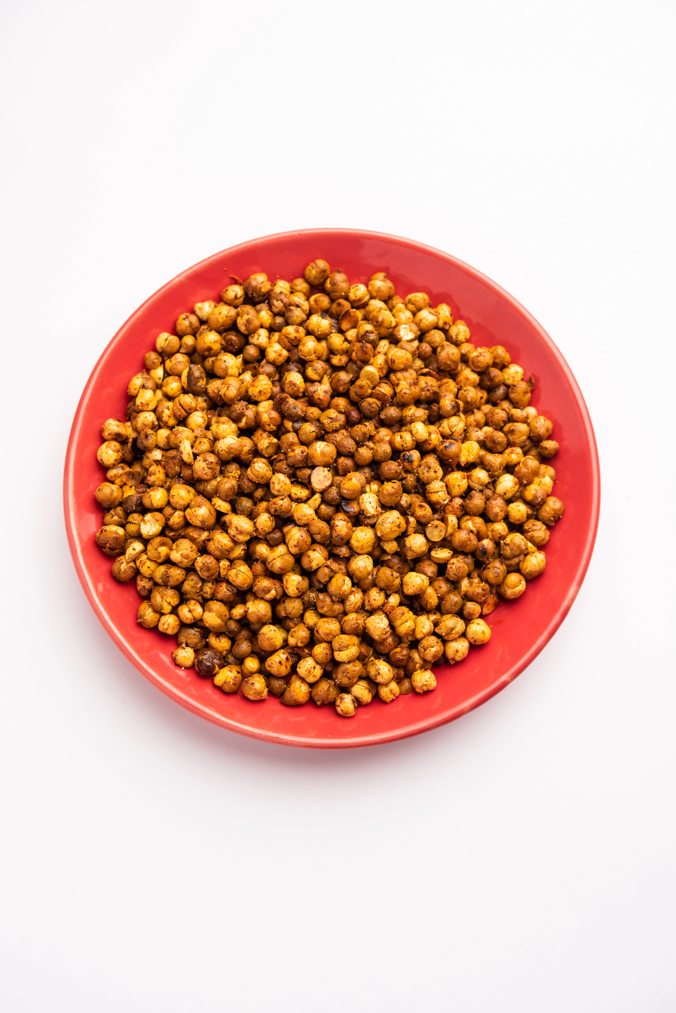 Roasted chickpeas in a red bowl