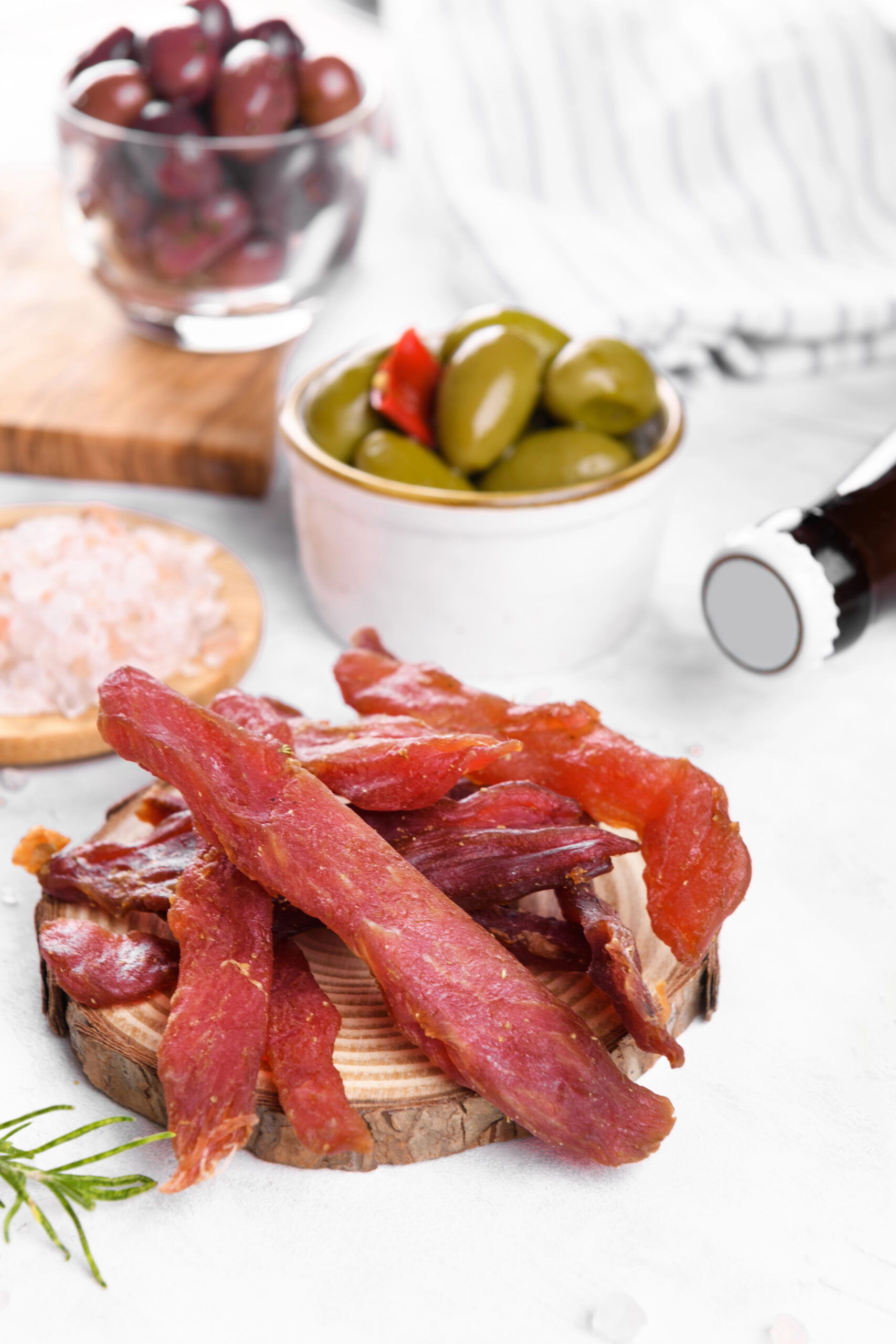 Spiced pork meat strips with olives and rosemary
