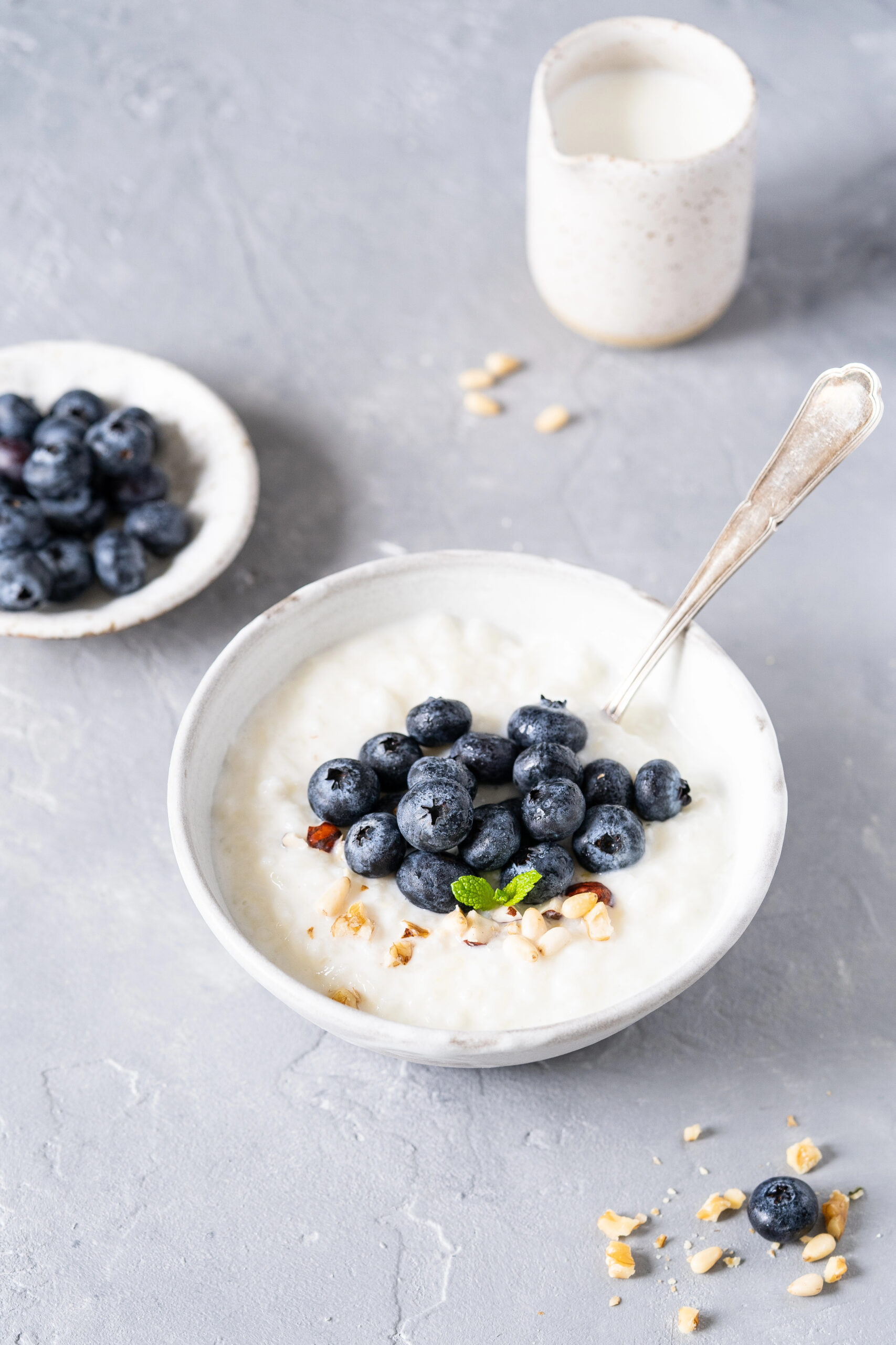 Rice porridge topped with blueberries and nuts