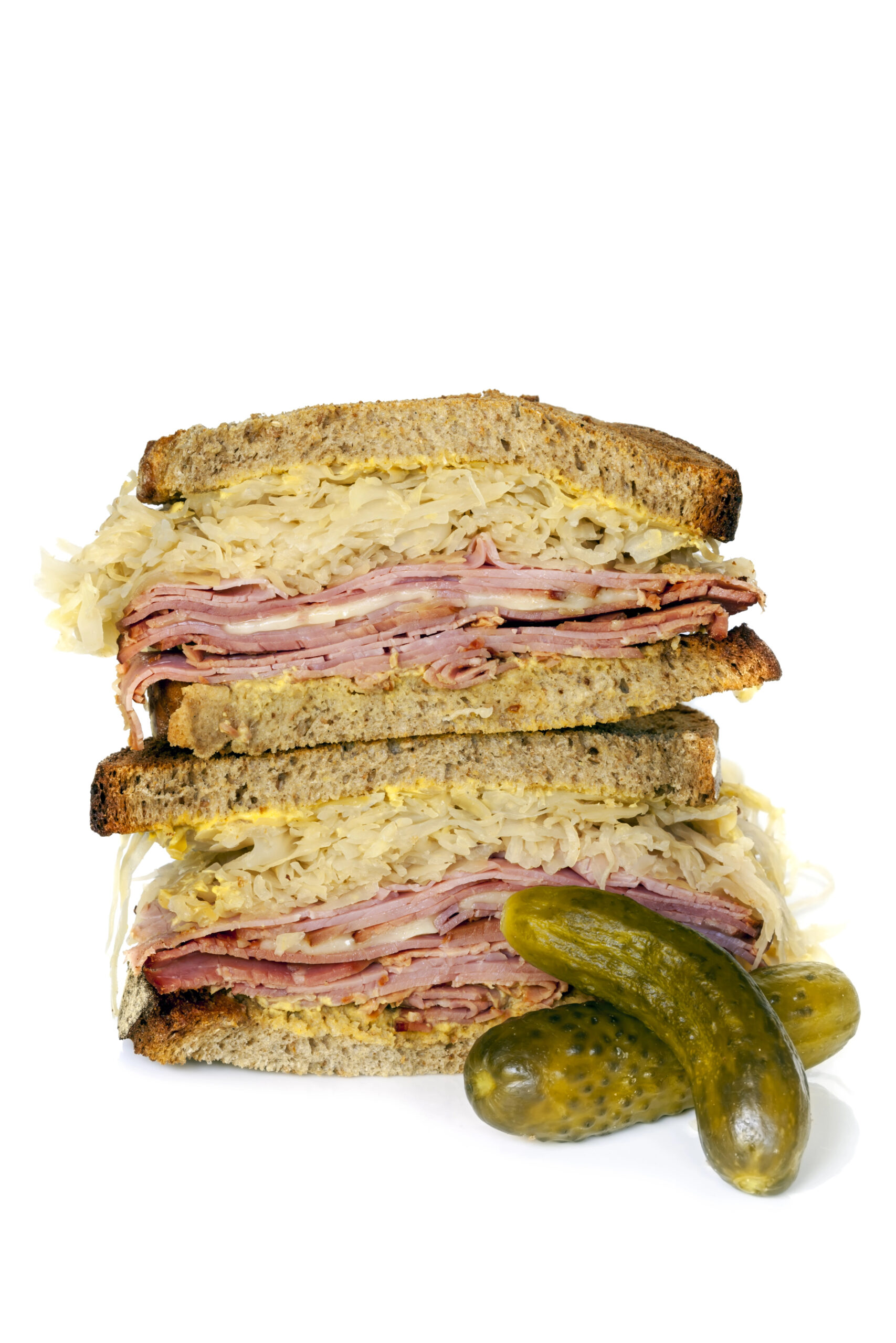 Stacked Reuben sandwich with pickles