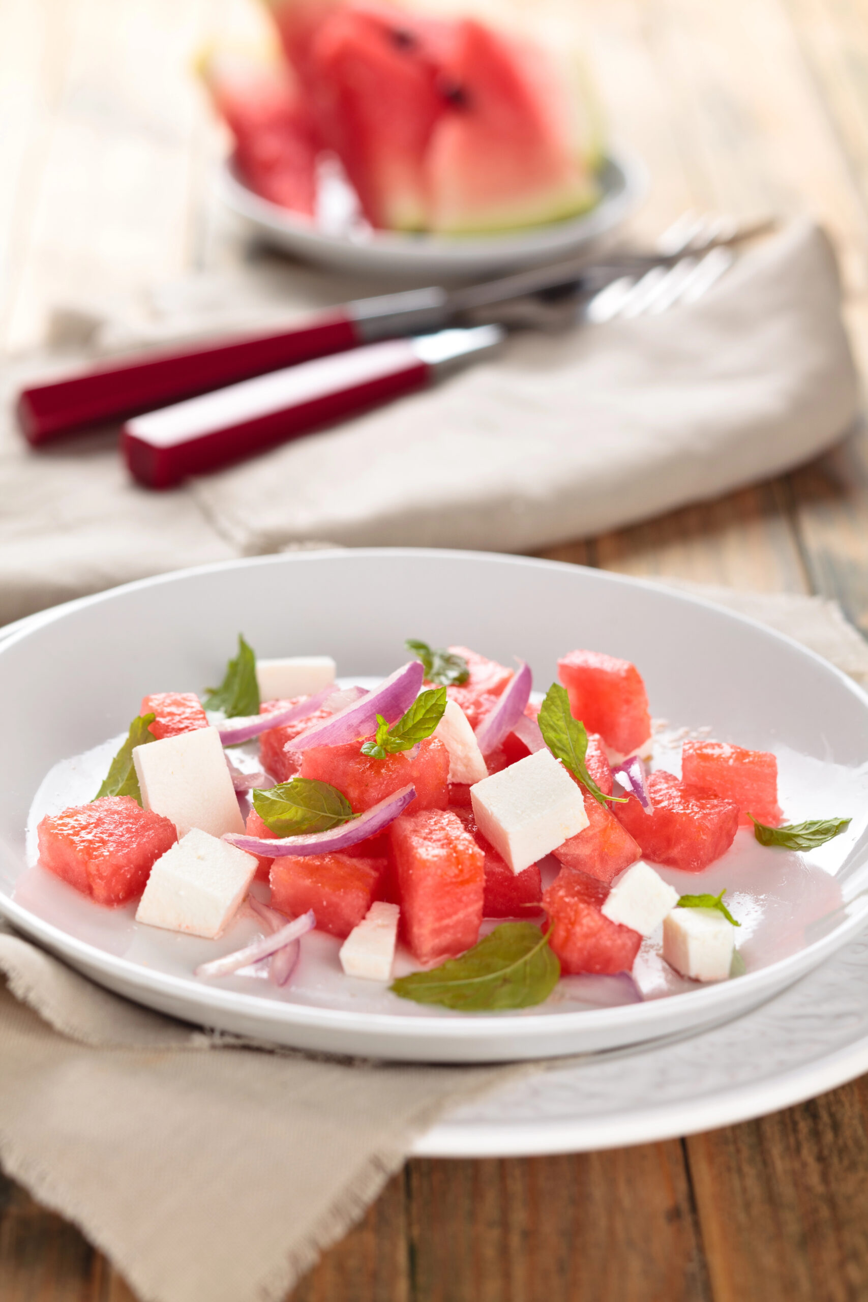 Watermelon and feta salad with mint leaves