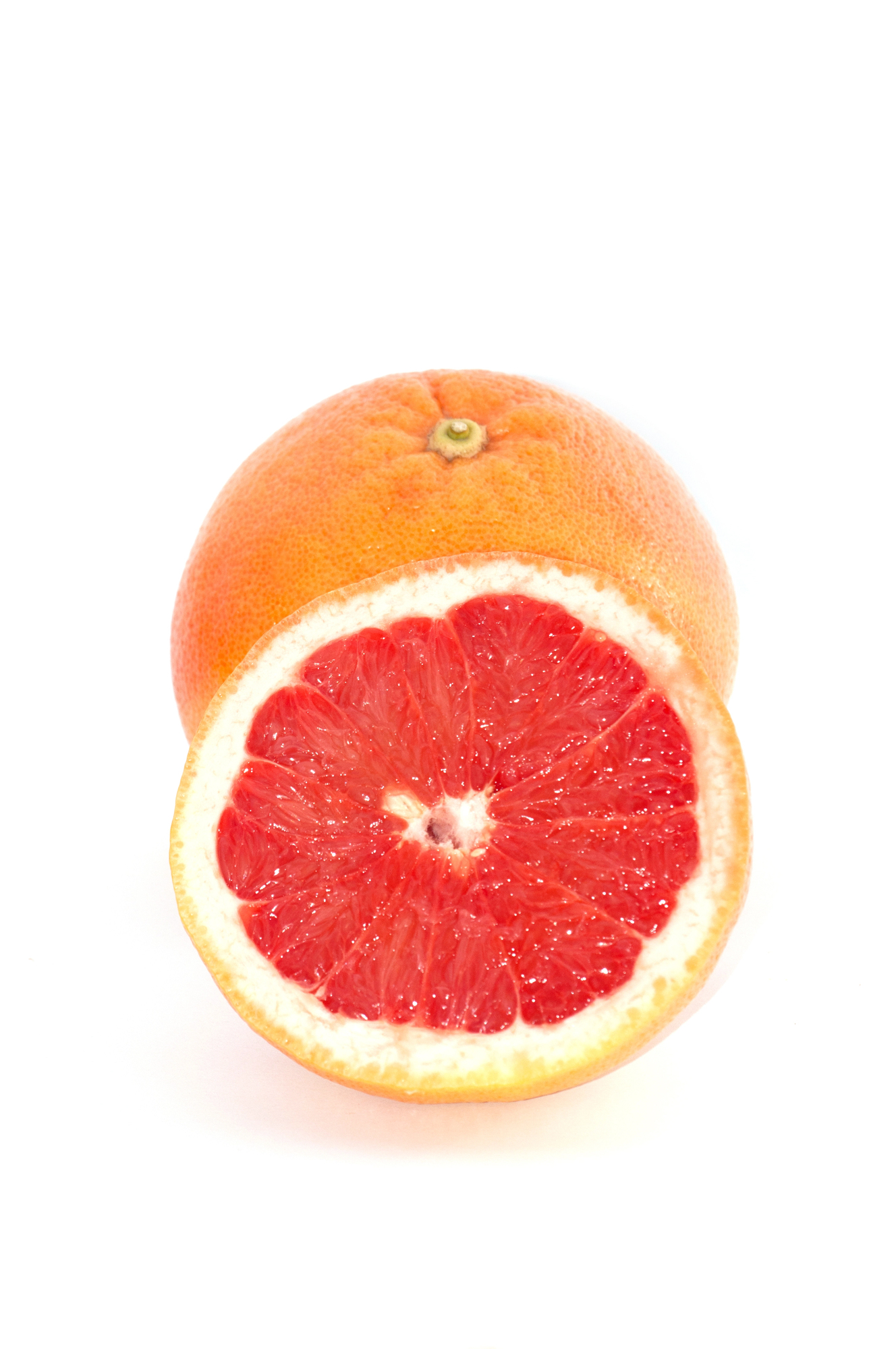 Halved ripe grapefruit with red flesh