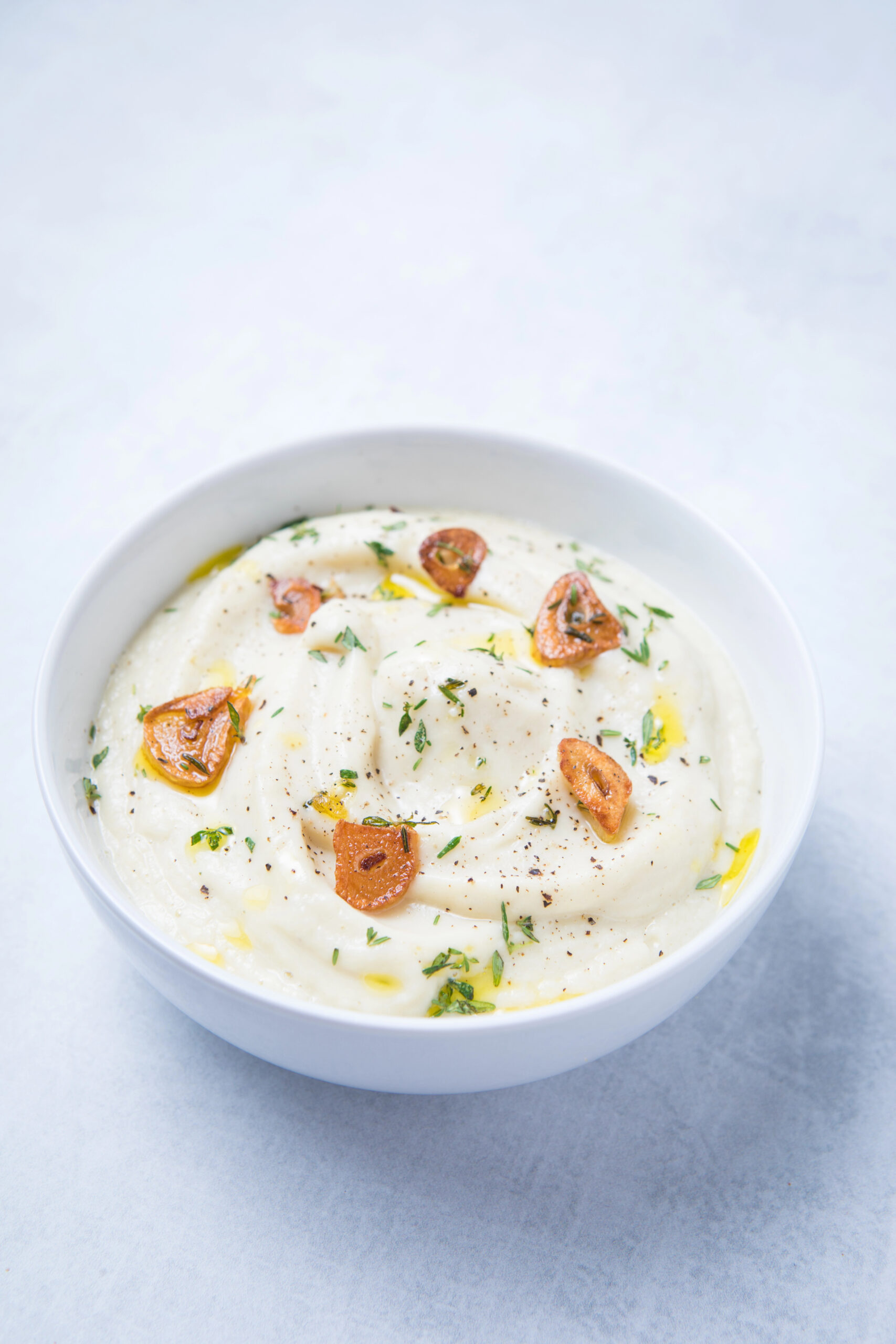 Cauliflower garlic mash in white bowl