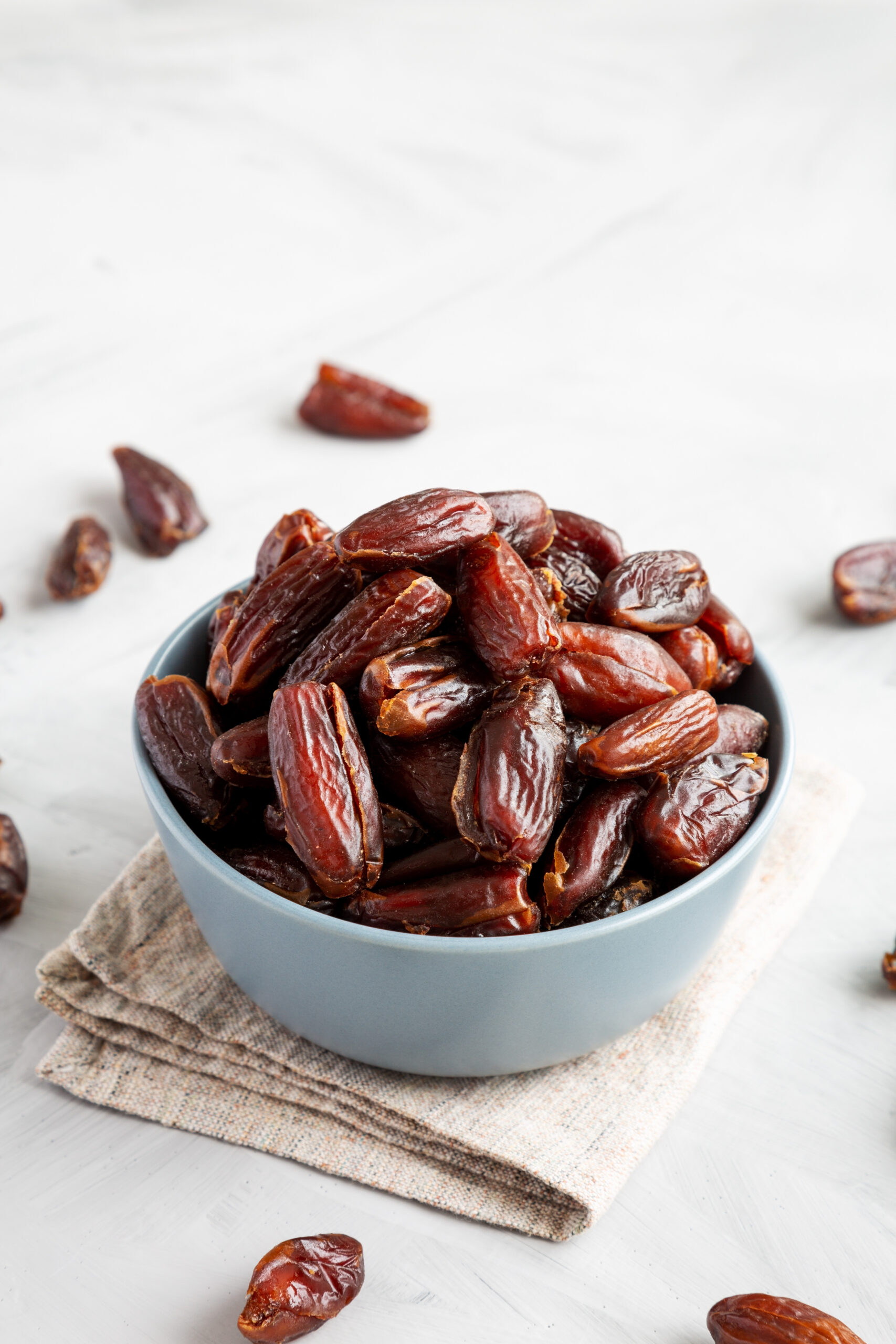 Pitted dates in a small blue bowl