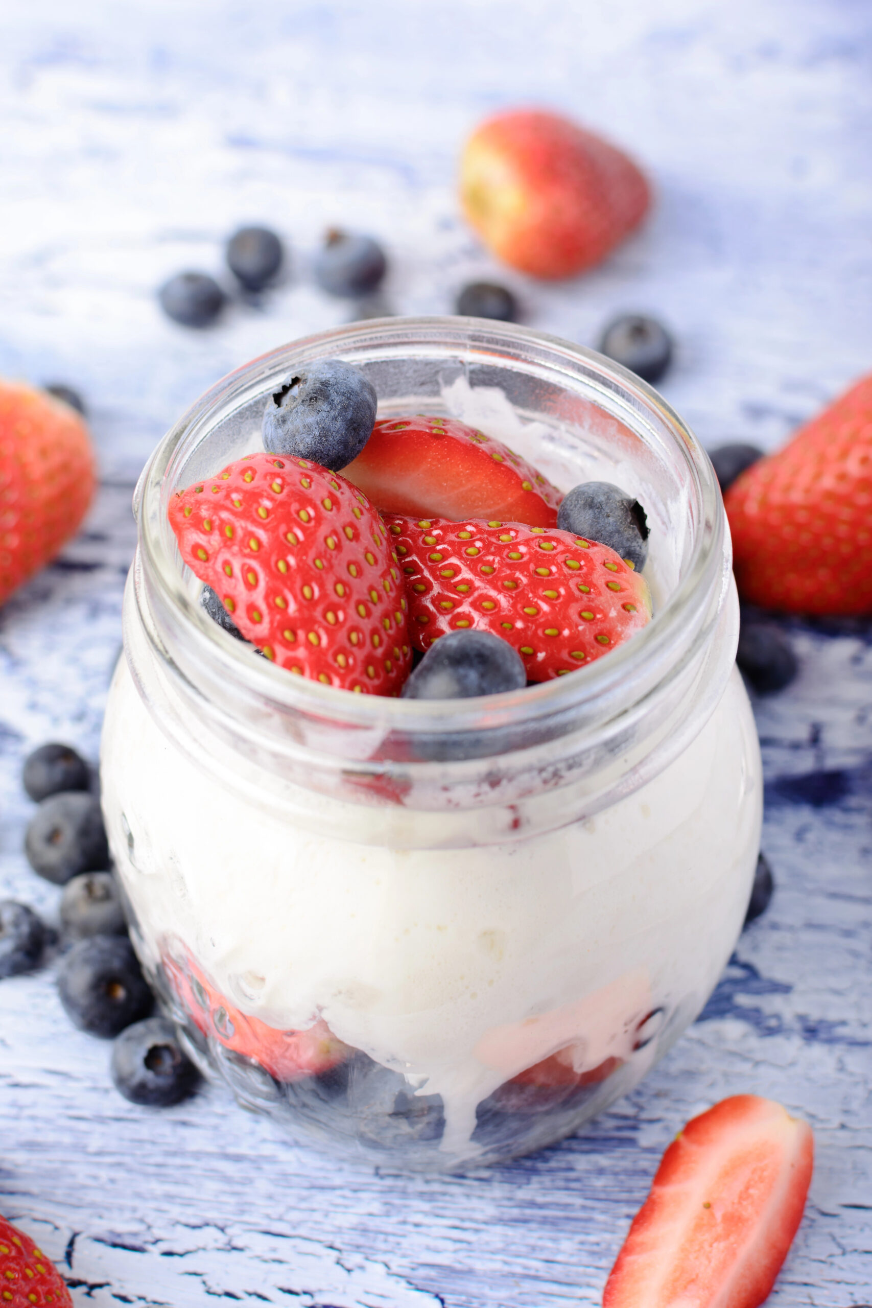 Yogurt in a jar with strawberries and blueberries