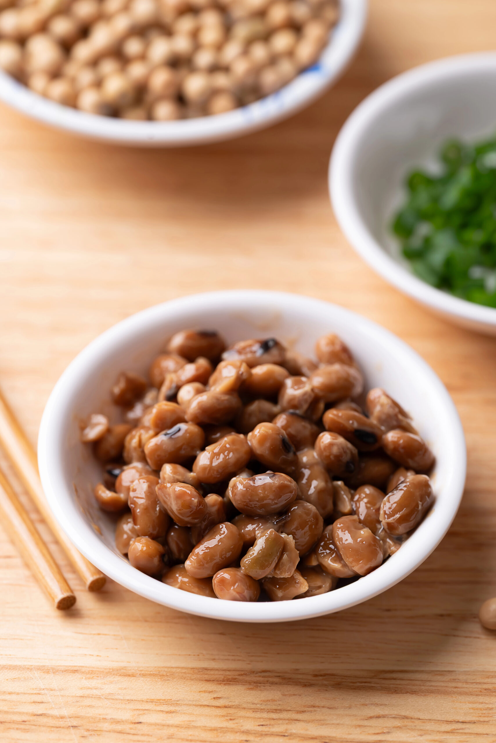 Natto fermented soybeans in white bowl