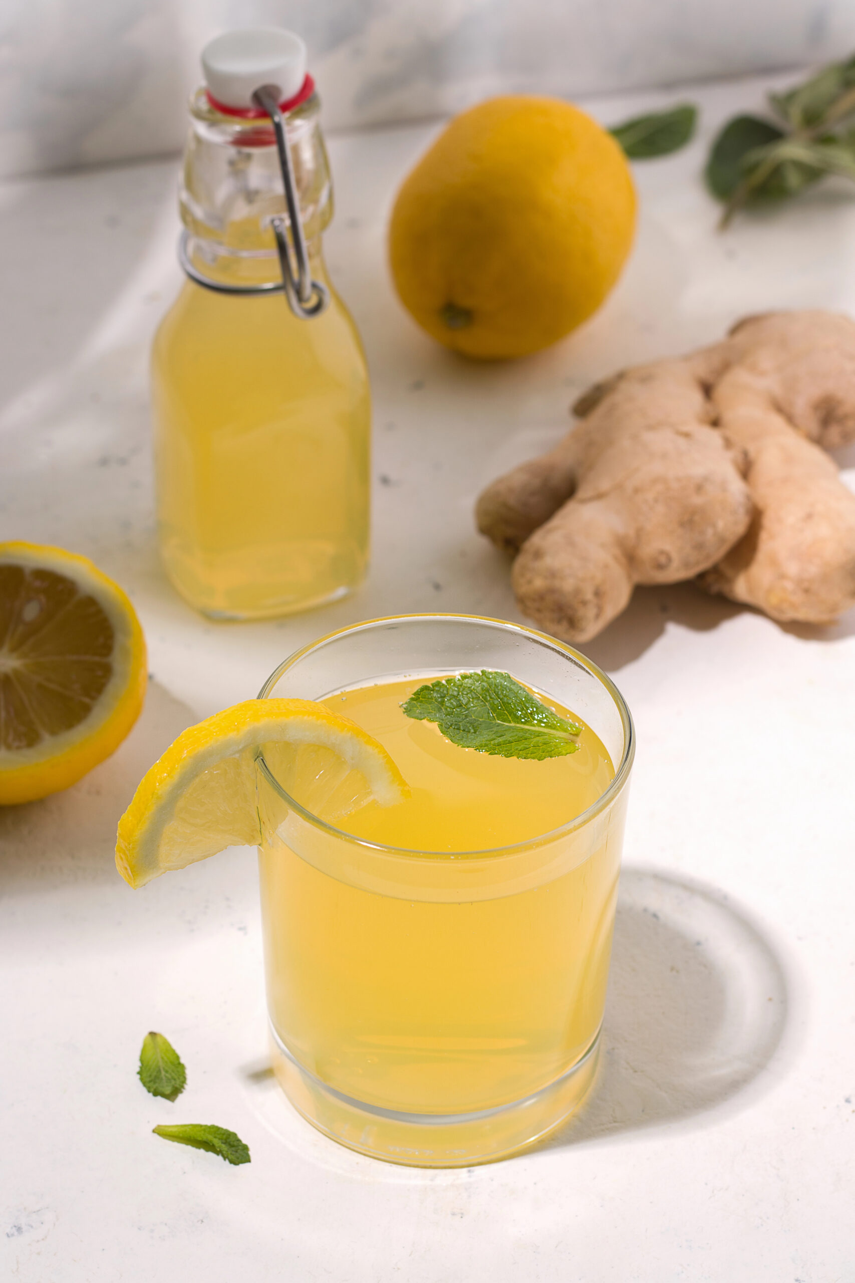 Lemon ginger drink with fresh lemon and ginger root