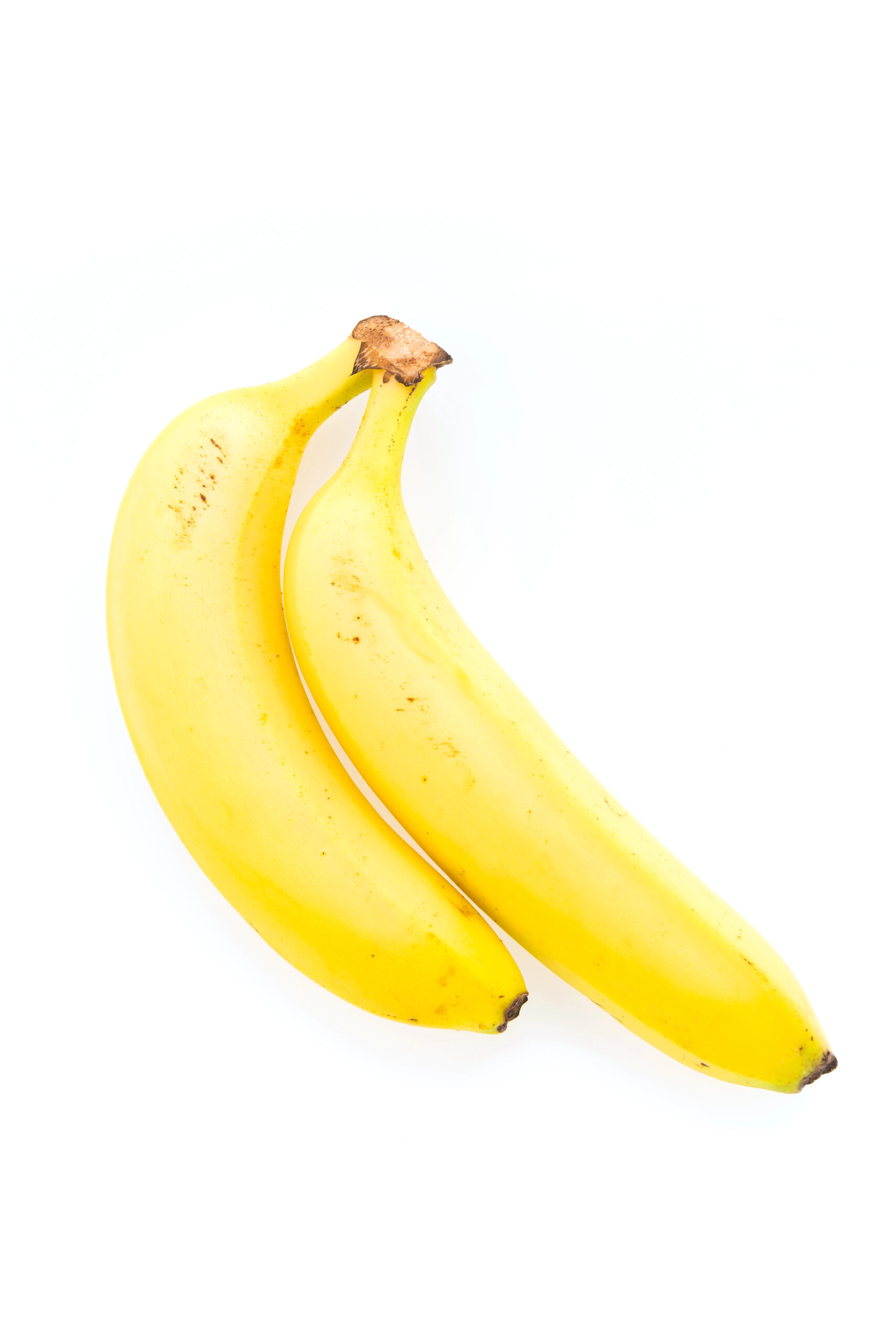 Two whole yellow bananas