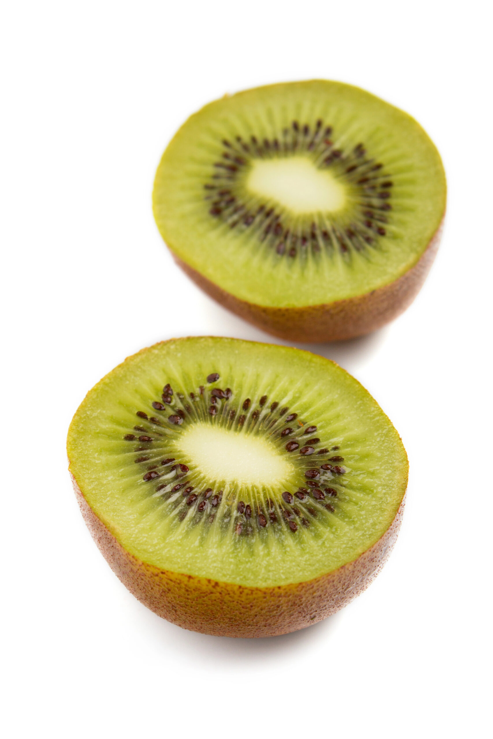 Two halved kiwi fruits