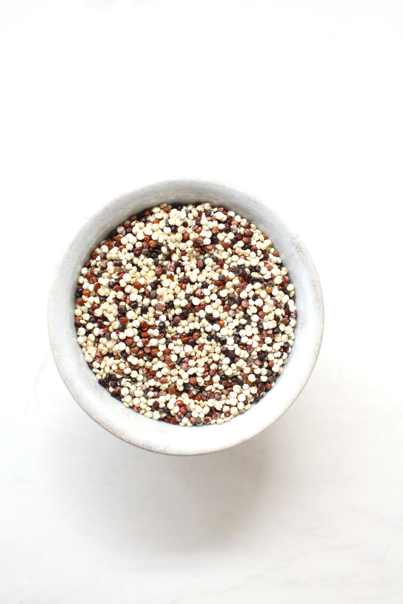 Quinoa grains in white bowl
